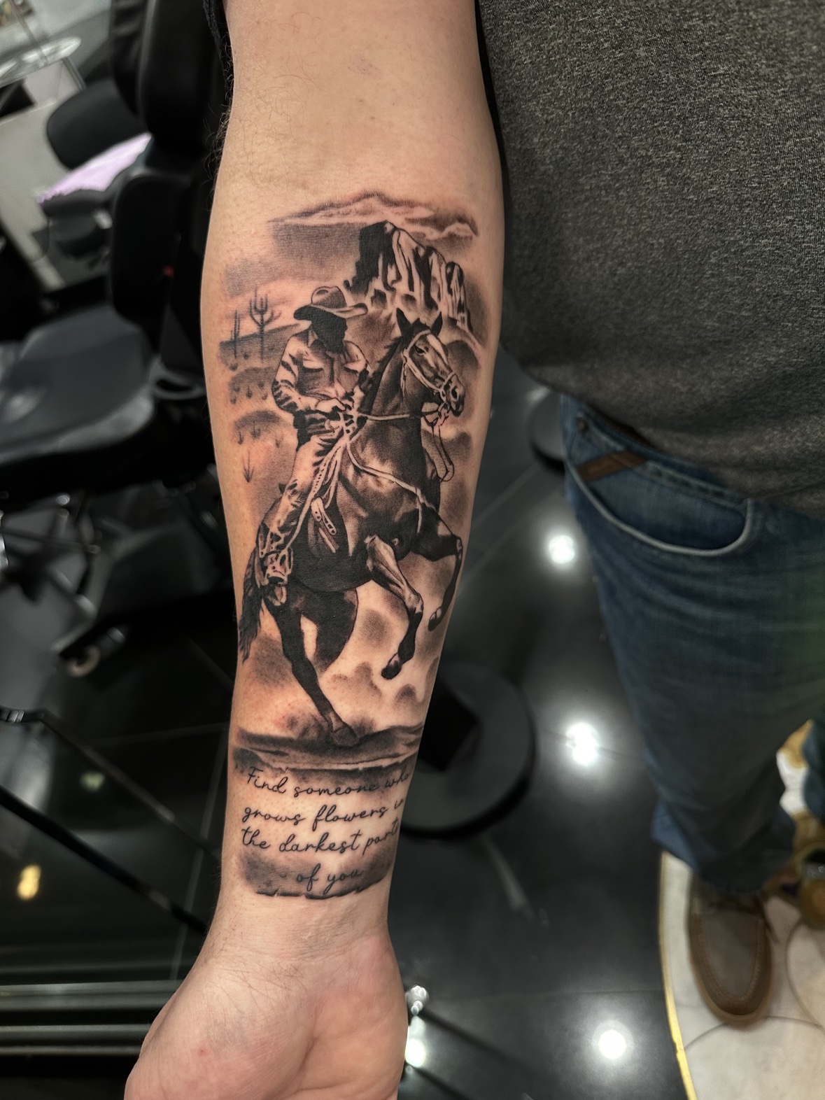 Cowboy on horse forearm tattoo