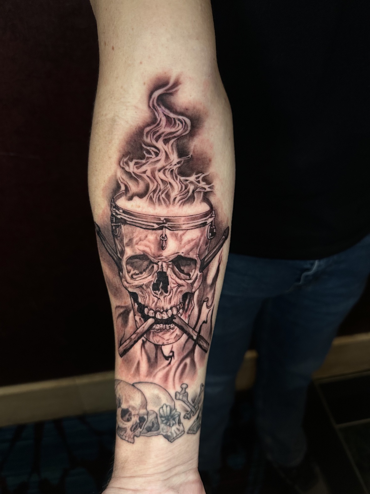 Skull drum forearm tattoo