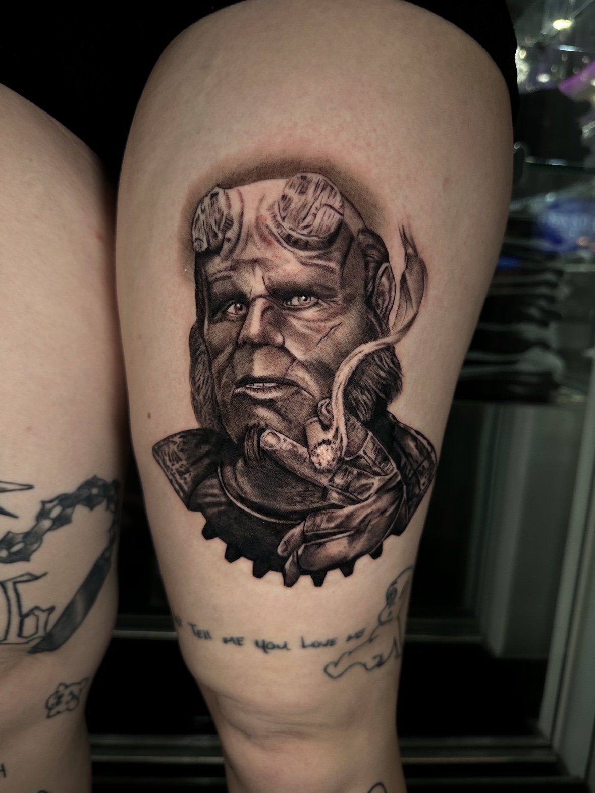 Hellboy portrait thigh tattoo